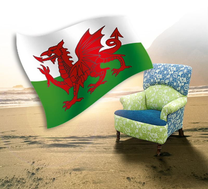 Armchair on beach with Welsh flag