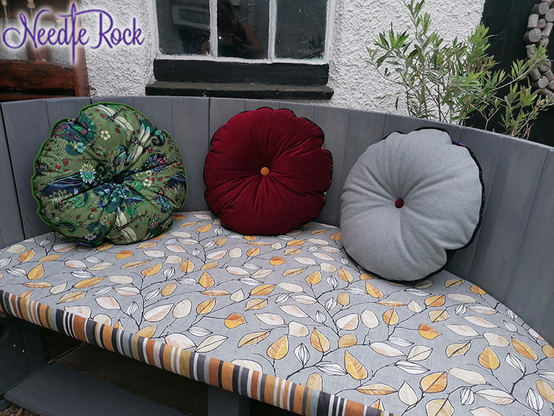 Remodelled hot tub seating, with reverse fabric on the large cushions with round cushions to match the colouring.
