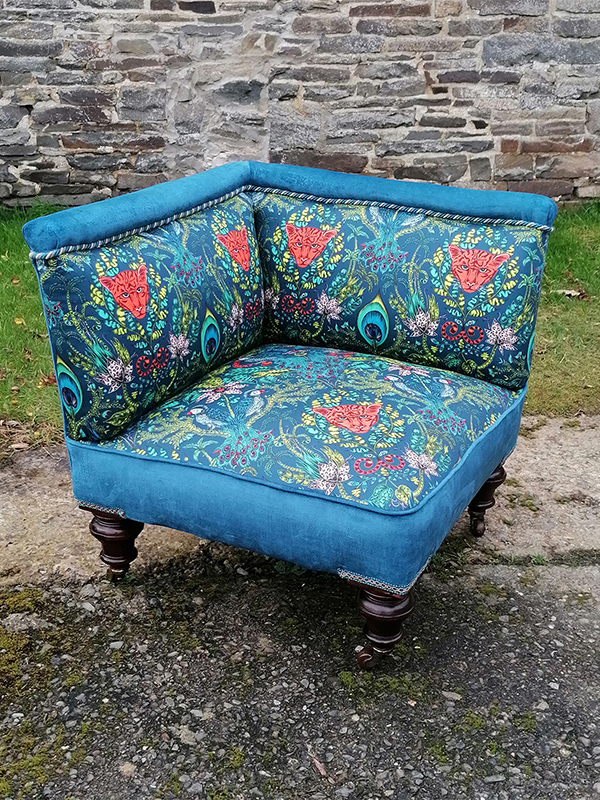 A fabulous corner chair reupholstered in fabulous Emma Shipley fabric.