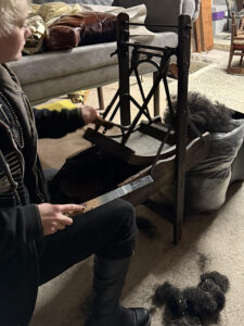 We tease the horsehair apart using our antique 'carding' machine that would have been used on the streets of France in the 1800's.