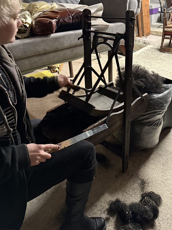 We tease the horsehair apart using our antique 'carding' machine that would have been used on the streets of France in the 1800's.