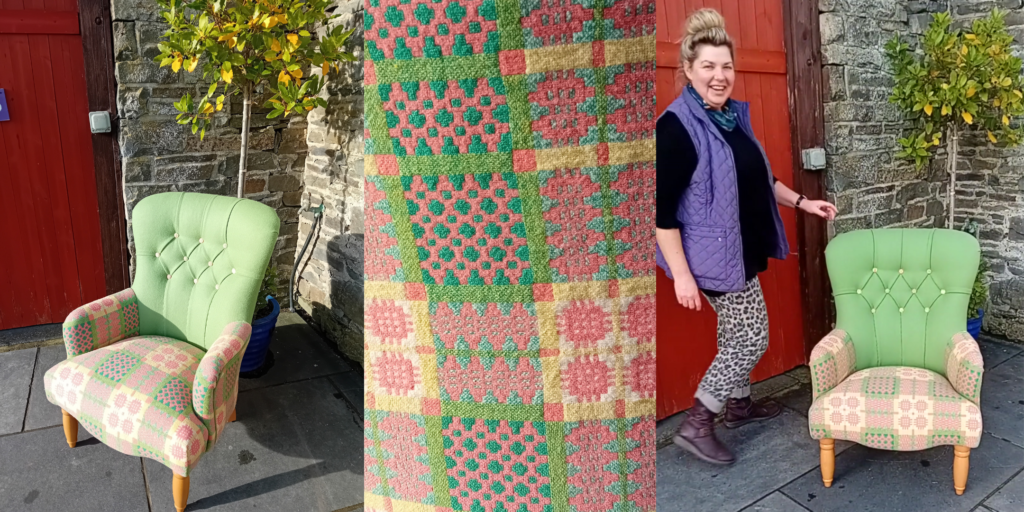 Full view of the stunning Welsh blanket chair with vibrant green wool and intricate patterns, alongside Needle Rock's cheerful team Ali - The Welsh Upholsterer.